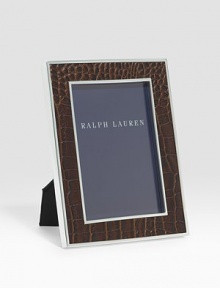 An elegant, silverplated brass frame, wrapped in alligator-embossed leather. Arrives in a gift box Accommodates a 4 X 6 photograph Overall: 6 X 8 Imported 