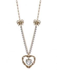 A lovely addition to your jewelry box. This long necklace from Betsey Johnson flaunts a dangling rope heart pendant with a crystal accent at the center. With a silver tone crystal cup chain accent and gold tone rope bows. Crafted in antiqued gold tone mixed metal. Approximate length: 32 inches + 3-inch extender. Approximate drop: 1-1/2 inches.