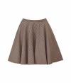 For a modern riff on classic equestrian chic, try McQ Alexander McQueens elegant cotton and wool blend swing skirt - In a traditional brown houndstooth pattern - Gently pleated, A-line cut hits above the knee and bells at hem - Slim waistband and back zip - Pair with a classic white button down or cardigan and platform pumps or ankle booties