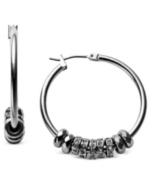 A little something extra from Fossil. These hoop earrings, crafted from silver-tone stainless steel, make a bold statement with round beads providing added appeal. Approximate diameter: 1-1/4 inches.