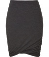 Sumptuously soft and effortlessly elegant, Donna Karans pure, charcoal grey cashmere knit skirt epitomizes understated luxury - Curve-hugging, medium-rise pull on style with hidden elasticated waist - Gorgeous signature drape and twist detail at hem - A chic go-to in any wardrobe perfect for pairing with cashmere pullovers, silk tops or button downs and ankle booties or platform pumps