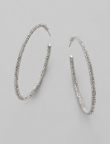 EXCLUSIVELY AT SAKS. Large, luxurious hoops, accented with the shimmer of pavé crystals. Crystals Rhodium plated Diameter, about 2¼ Stainless steel post back Imported