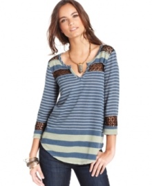 Sheer crochet insets show a hint of skin on this Free People striped top for a sexy spin on a casual basic!