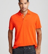 Enzyme-washed for super-rich color and rendered in slubby cotton for a textured feel, this casual cool solid polo looks and feels great everywhere you wear it.