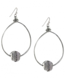 Well-rounded fashion from Jessica Simpson. These oval hoop earrings showcase round crystal accents. Crafted in antiqued worn silver tone mixed metal. Approximate drop: 2-1/2 inches.