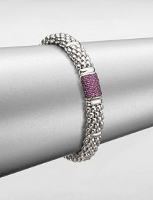 From the Muse Collection. An iconic caviar texture in sleek sterling silver accented with a pretty pink sapphire station. Sterling silverPink sapphireLength, about 7.5Box and tongue closureImported 