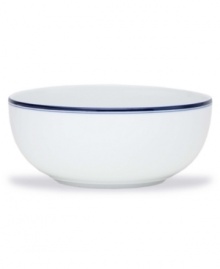 Named for a trendy Copenhagen neighborhood but designed with timeless style, the large Christianshavn Blue serving bowl features a double band of navy in pristine white porcelain. From Dansk.