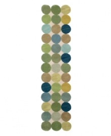 A series of colorful circles stand side-by-side to create a serene ocean of washed out shades of green, blue and gold over a neutral ground. The runner's unique edge, comprised of the collective curves of the outer circles, brings a modern touch to any room in your home. Hand-tufted with an intimate blend of synthetic fibers for a soft, yet durable construction.