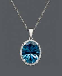 Take your style up a notch with bright, bold color. This brilliant oval-cut London blue topaz (4-1/10 ct. t.w.) sits in a shining 14k white gold setting with a sweet dusting of diamonds at the edges. Approximate length: 18 inches. Approximate drop: 5/8 inch.