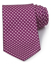 A luxurious piece that lies at the center of your dress wardrobe, this handsome tie from Salvatore Ferragamo is crafted in 100% Italian silk.