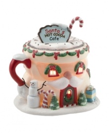 At Santa's Cafe, everyone gets a taste of Christmas magic. In the shape of a hot chocolate-filled Santa mug, this fun piece mixes the fantasy and cheer of the season, showcasing all the holiday favorites-candy canes, a snowman, colorful presents, snow-dusted trees and more.