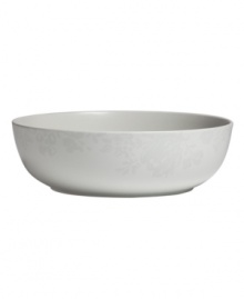 The dual-purpose Bliss cream soup or pasta bowl from Monique Lhuillier for Royal Doulton is made for every day, shaped for modern decor and draped with romantic florals in a soft, muted palette.