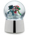 One cool couple shares a romantic moment under a flurry of snow and to the tune of Joy to the World in this adorable snow globe from Towle.