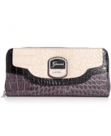 Wildly practical. GUESS brings an exotic outlook to the everyday with this faux croc-embossed leather wallet, featuring signature detailing and convenient wristlet strap. Ideally sized to slip inside a handbag, it boasts plenty of pockets and compartments for all the essentials.