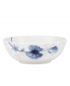 A fresh take on floral patterns, the Watercolors Indigo Blue bowl features painterly blossoms in shades of blue against a lively geometric design. White bone china in an ultra-modern shape provides a sleek foundation for a look that's irresistibly fun. Qualifies for Rebate