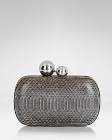 DIANE von FURSTENBERG tips the scales with this night-right minaudiere. Crafted of watersnake in a clutchable shape, it's ready to snake, rattle, and roll to your next affair.