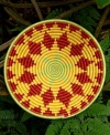 This jubilant handwoven fruit bowl brings a burst of color to any decor. Bright yellow, bold red and a lush center leaf of green capture the sun-drenched beauty of the Rwandan countryside in spring. (Clearance)