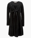 A little black dress for the diva in-training. She'll steal the spotlight in this glitter shrug dress from Speechless.