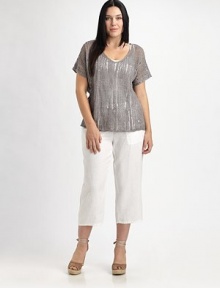 Shimmer and shine in this airy knit enhanced by metallic thread. It also features a feminine neckline and beloved fit.V-neckShort sleevesPull-on styleAbout 23 from shoulder to hem83% linen/16% metallic thread/1% cottonHand washImported of Italian fabric