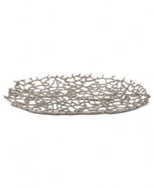 Natural wonder. Organically molded, cast and finished by hand, the Abstract Coral oval tray exemplifies Donna Karan's love of elemental textures. Nickel-plated brass echoes the intricate tendrils of undersea creatures yet perfectly suits modern tables.