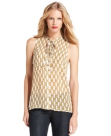 MICHAEL Michael Kors' latest blouse features an on-trend tie neckline and a chain-inspired print that seamlessly weaves in the signature logo.