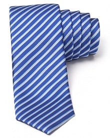 The slim, modern silhouette of this alluringly striped tie separates it from the old guard. Wrought in exceptional silk for a luxurious addition to your wardrobe, it pairs well with fine dress shirting and more casual looks alike.