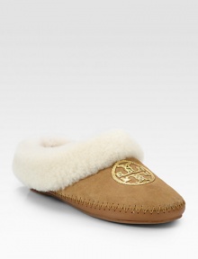 Light-catching sequins form a signature medallion on this casual suede staple lined with cozy shearling. Suede and shearling upper with sequinsShearling liningRubber solePadded insoleImported