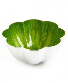 More than conversation blossoms around your table with the handcrafted Lemongrass Lotus bowl from Simply Designz. Polished aluminum lined in glossy enamel lends fresh color and shine to any dining area.