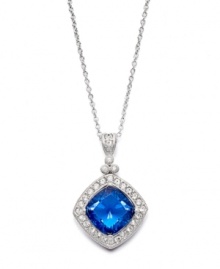 Evening-ready and perfect for an elegant affair, Eliot Danori's stunning pendant highlights a diamond-cut blue glass center highlighted by a halo of sparkling clear crystals. Crafted in silver tone mixed metal. Approximate length: 16 inches + 2-inch extender. Approximate drop: 1 inch.