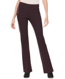 Chic seam design creates a streamlined effect on these petite bootcut-style trousers from INC.