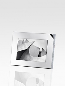 A modern and sophisticated frame stylishly blends the strong, sharp lines of stainless steel with a myriad of tiny faceted clear crystals. Accommodates a 4 X 6 photograph Overall: 5½ X 7 Imported 