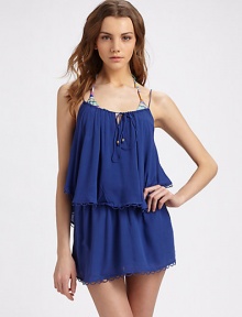 Delicate scalloped trim details the playful tiers of this flowy design, complete with a drawstring neckline.Spaghetti straps Drawstring neckline with metal tie pulls Tiered ruffle hem Scalloped trim Logo charm on back About 30 from shoulder to hem Rayon Hand wash Imported Additional Information Women's Premier Designer & Contemporary Size Guide 