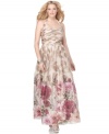 Enchanted garden: A neutral leaf print becomes a colorful poppy print at the hem of this charming plus size evening gown by Adrianna Papell. The halter neckline and pleated bodice lend the silhouette sophistication.