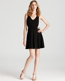 Mesh details at the waist give an alluring look to a fit & flare dress from ERIN Erin Fetherston.