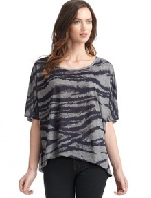 THE LOOKScoop necklinePullover styleShort dolman sleevesFront zebra print with solid contrast backAsymmetrical hemLeft vented hemTHE FITLoose fit silhouetteAbout 29 from shoulder to longest point of hemTHE MATERIALPolyesterCARE & ORIGINMachine washImported