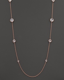 Ice-like drops of clear, bezel-set faceted quartz stud a chain of rose gold.