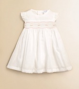 This design featuring beautiful rosebuds and elegant pleating is the perfect dress for your little one. Round necklineRuffled cap sleevesRosebuds with scalloped trimBack button closurePima cottonMachine washImported