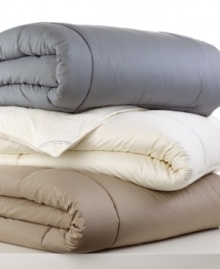 In true Calvin Klein style, this Essential Colored comforter lends a touch of simple sophistication to the bedroom with a plush 300-thread count cotton cover and your choice of three neutral hues.