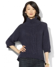 Lauren Jeans Co.'s chunky knit sweater is crafted with an oversized turtleneck and a modern high-low hem.