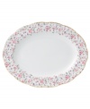 Scattered with dainty blooms, the Rose Confetti oval platter restores the grace and charm of another era in fine bone china from Royal Albert. A scalloped edge with gold banding and a traditionally feminine palette add to its romantic sensibility.