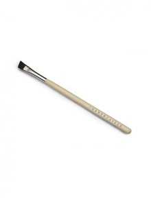 A small, soft angled brush to shape eyebrows, made of boar bristle. 