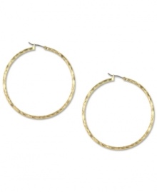 Hints of subtle texture create a look that's modern and elegant on these Jones New York hoop earrings. Crafted in gold tone mixed metal. Approximate drop: 3/4 inch.