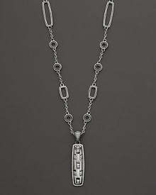 John Hardy's tribal-influenced station necklace features rectangle and circle stations and a carved pendant at the base.