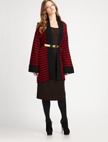 This open front, kimono shaped cardigan in drop-stitched merino wool stripes makes a stunning alternative to a jacket or sweater.Wide solid knit neckline and front trimOpen frontLong kimono-shaped sleeves with contrast cuffsAbout 36 from shoulder to hemMerino woolDry cleanImported