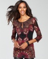 Delicate beading adds even more sparkle to the intricate, exotic print decorating INC's petite tunic top.