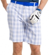 Feel as good as your swing looks in these plaid performance golf shorts from Izod featuring UPF 15 and fast-drying fabric.