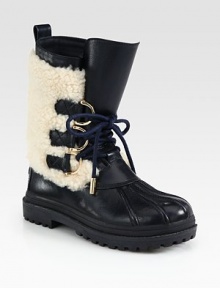 A seasonal leather staple with plush shearling trim and metal-tipped laces. Rubber heel, 1 (25mm)Shaft, 9Leg circumference, 12Leather and shearling upperPull-on styleShearling liningRubber trek solePadded insoleImported