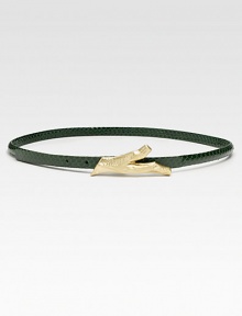 A skinny, supple rattlesnake leather belt with a brass twig closure.Width, about .5Imported