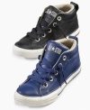 He can run the streets in these mid-top Chuck Taylor All Star street sneakers from Converse.