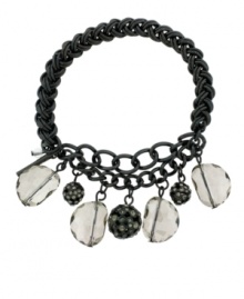 Not-so-basic black. Featuring fashion's favorite color, faceted glass accents and rounded charms add a unique twist to Kenneth Cole New York's stylish stretch bracelet. Made in mixed metal, the stretch design lets it slip on and off effortlessly. Includes a signature gift box. Approximate length: 7-1/2 inches.